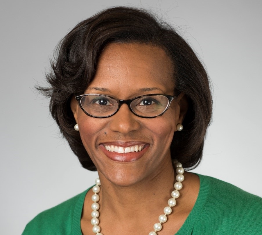 Portrait of Brownsyne Tucker Edmonds smiling at the camera.