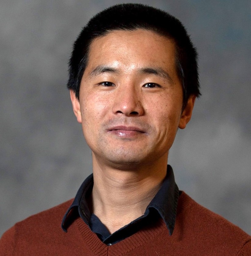 Portrait of Lixin Wang smiling at the camera.