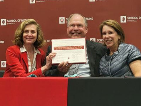 IU President Pamela Whitten, left, with Bill and Mary Stone.